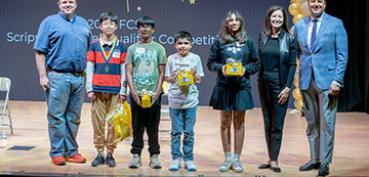 Spell Off winners along with the Superintendent of schools